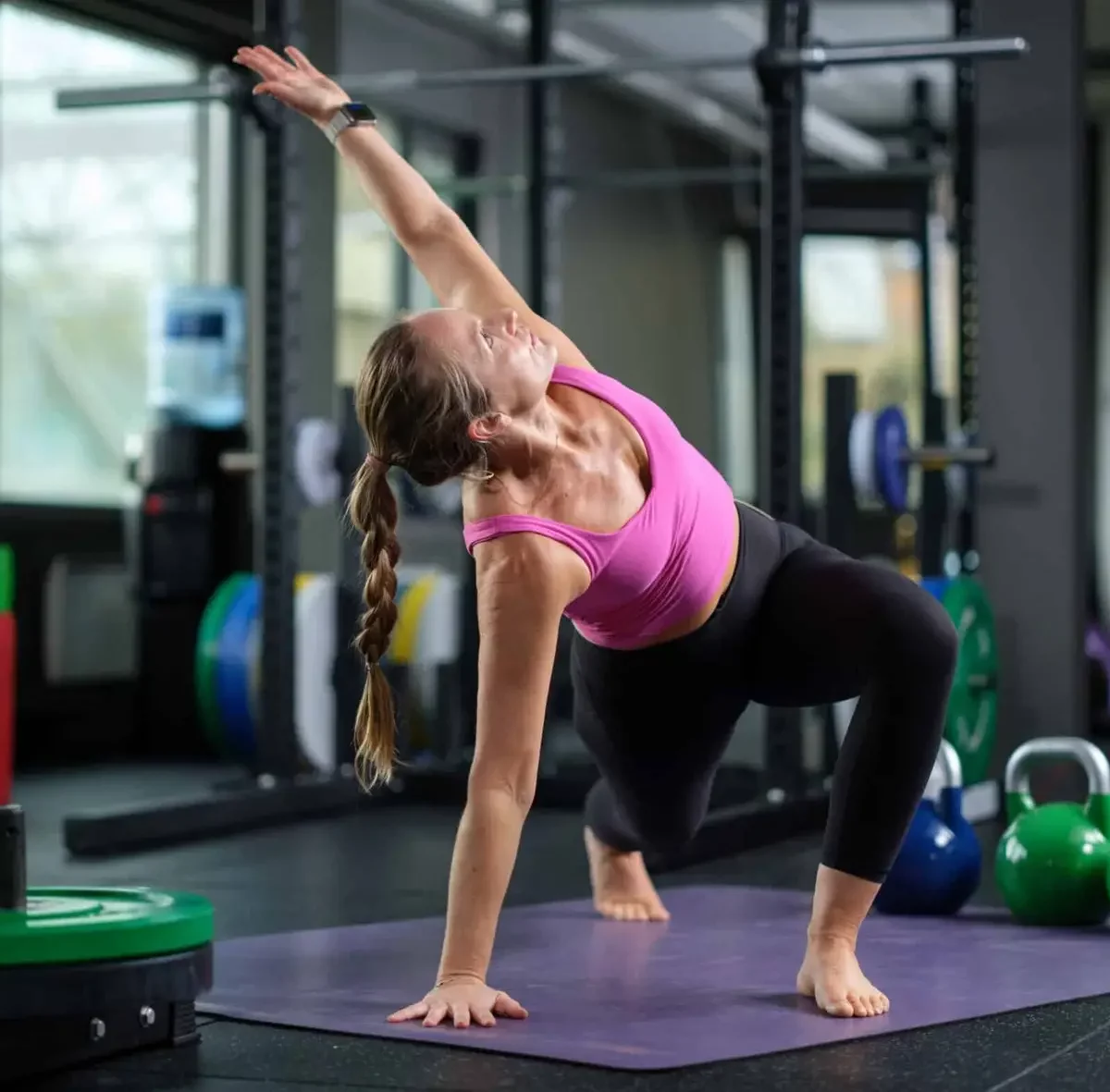 Trainer performing kettlebell exercises